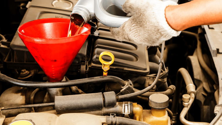 Changing Oil with funnel Image